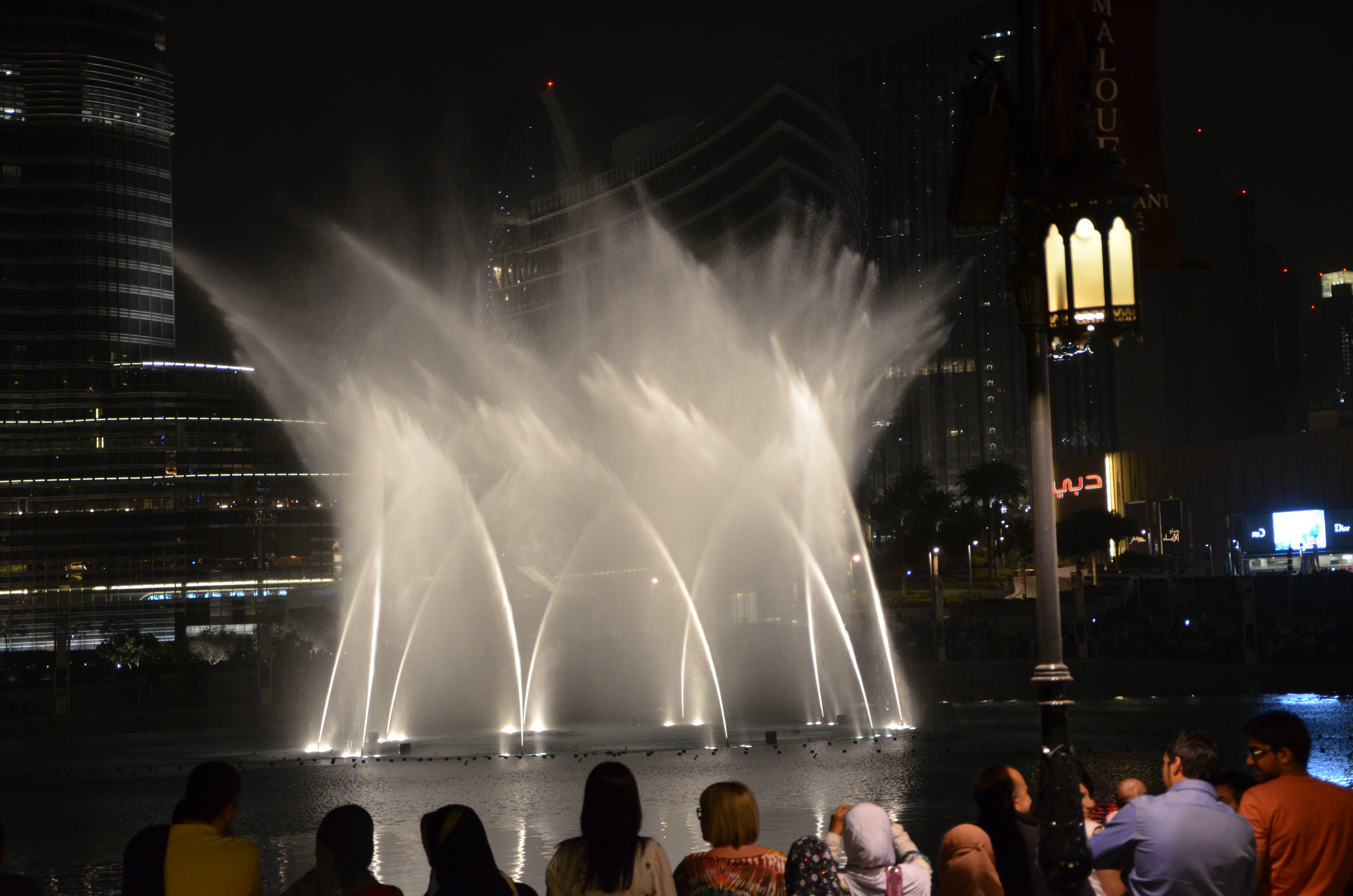 The Dubai Fountain illuminated during an evening water show